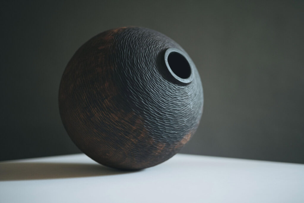 Oliver Chalk, Carved Cherry Vessel I, Stained and finished with Tung oil, 25 x 25 cm on view at gallery 57 © The Artist