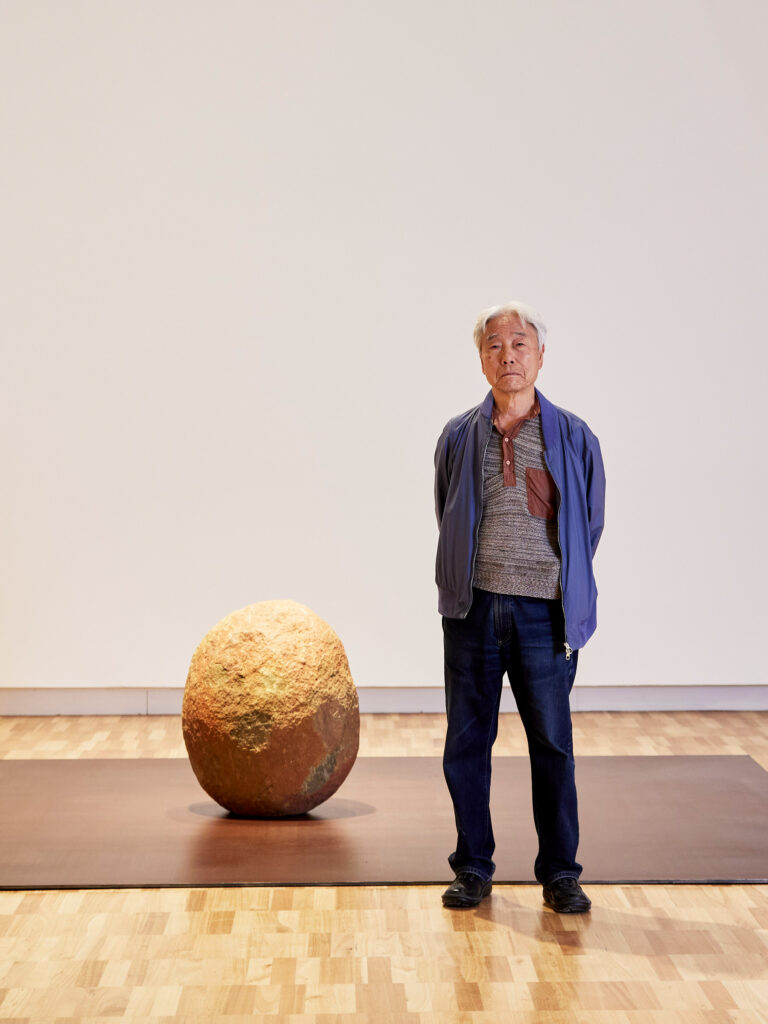 Lee Ufan with his work 'Relatum – position' 1968/2024 as part of the 'Lee Ufan: Quiet Resonance' exhibition at the Art Gallery of New South © Lee Ufan, photo © Art Gallery of New South Wales, Felicity Jenkins