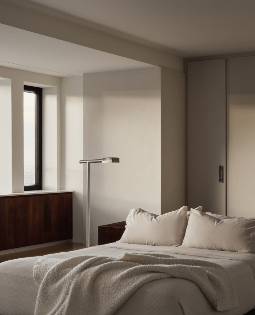 Master bedroom featuring floor lamp by Lambert & Fils, millwork by Kastella, mass walls in lime plaster finish. Photography by Alex Lesage